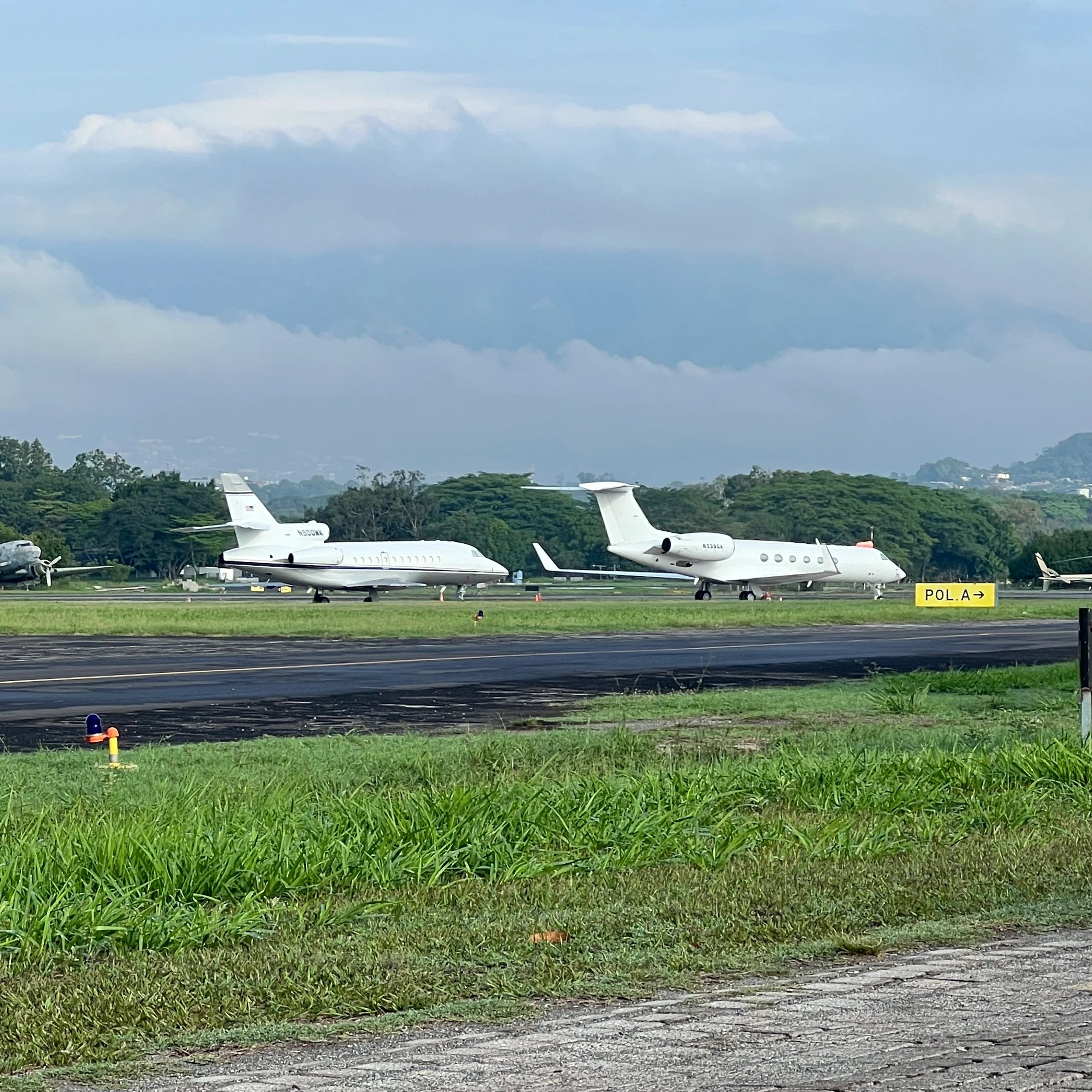 Business jets parked at tropical airport